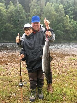Tyler with his first salmon and a proud father Danny